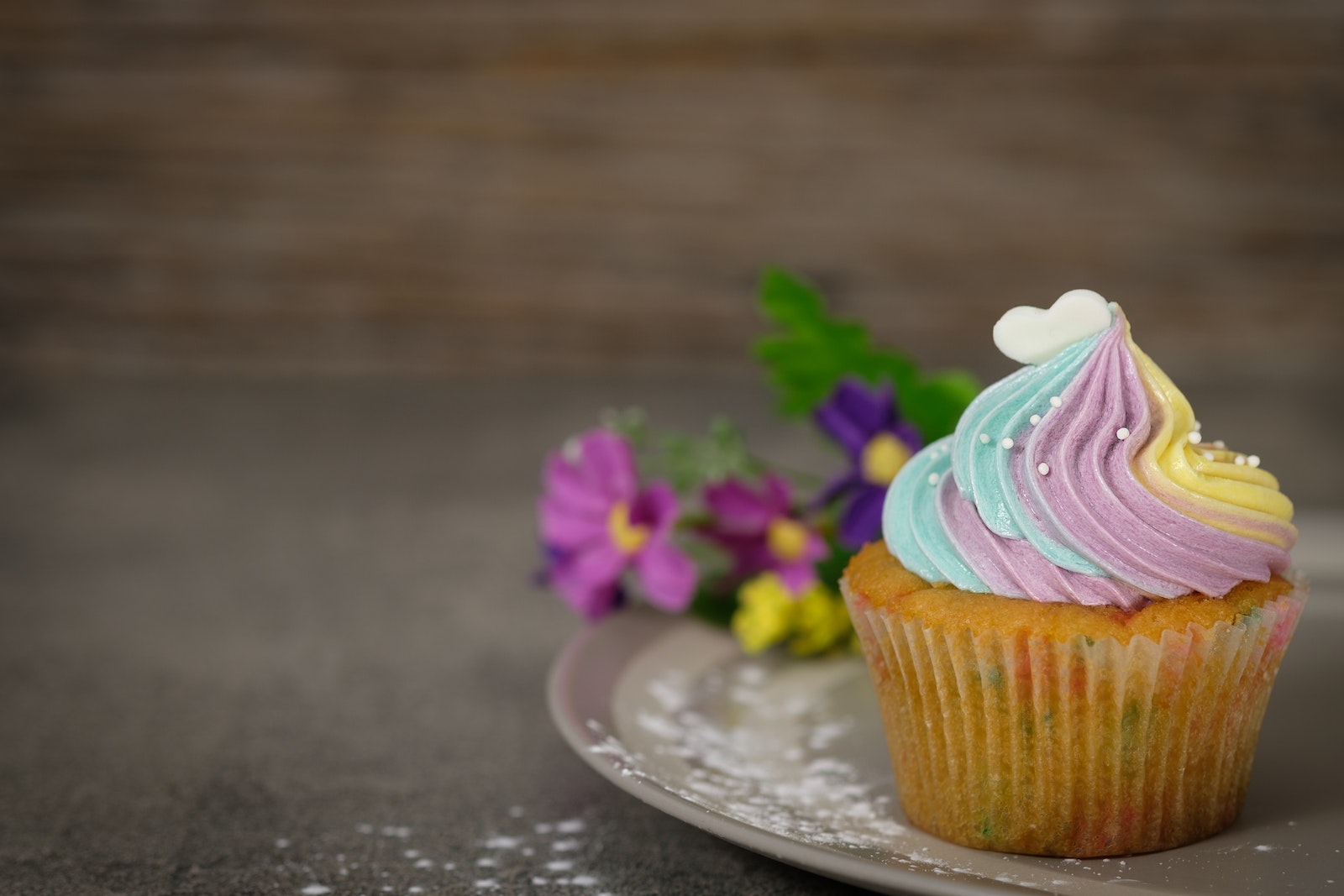 Close Up Photography of Cupcake on Gray Ceramic Plate