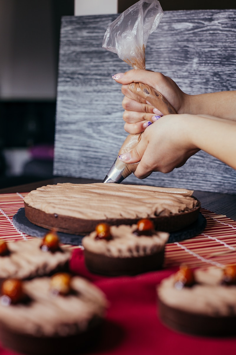 a person cutting a cake